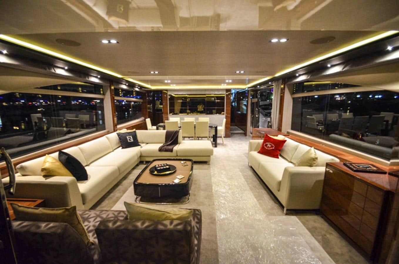 a living room with a couch and a table aboard SEDNA Yacht for Sale