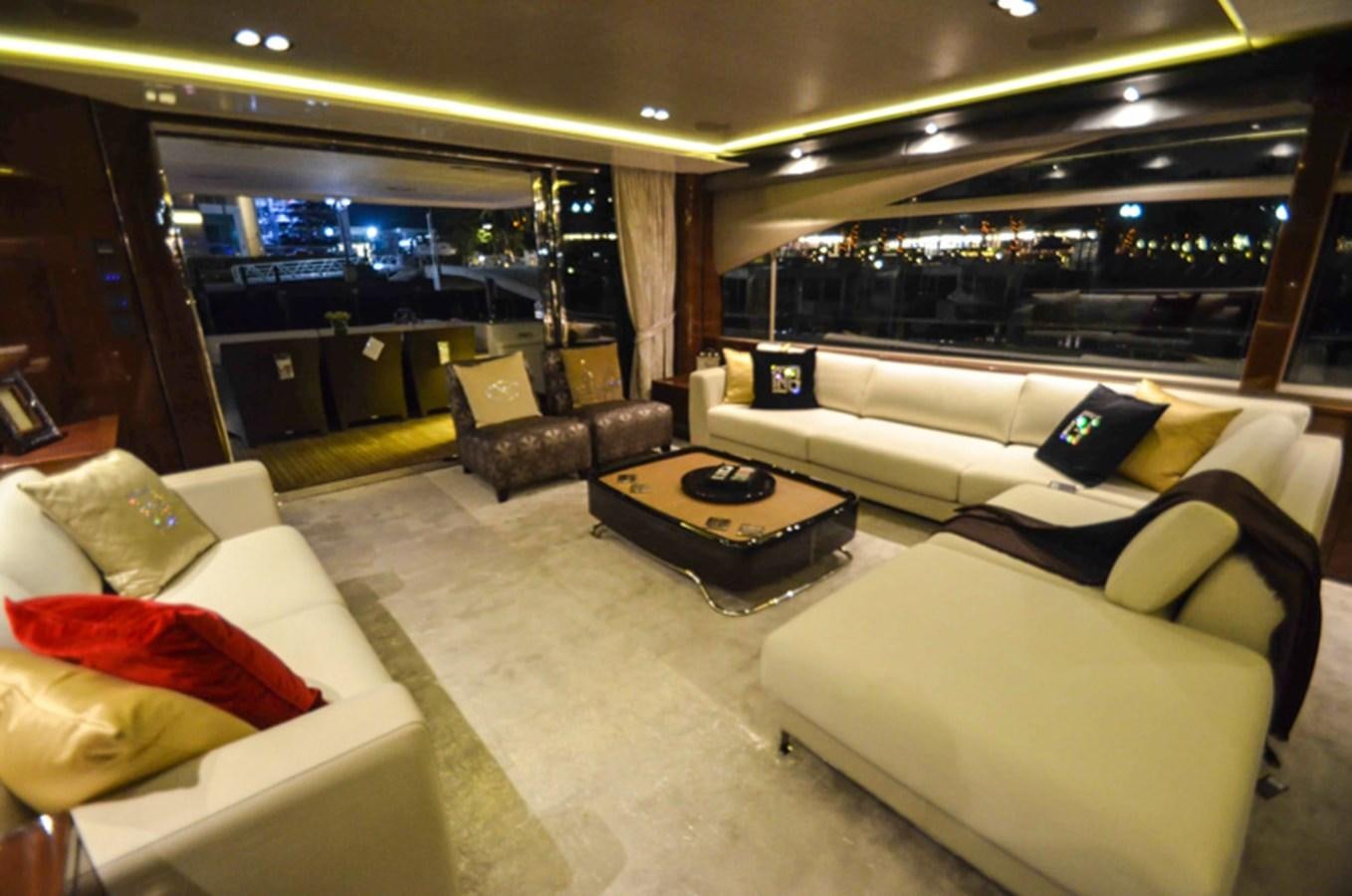 a living room with couches and a table aboard SEDNA Yacht for Sale