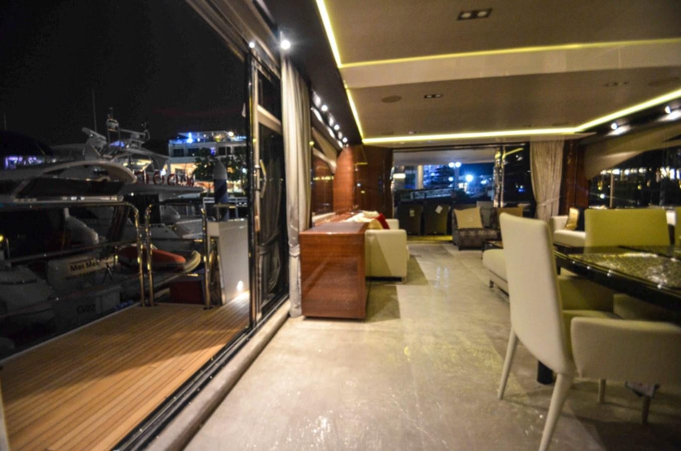a room with tables and chairs aboard SEDNA Yacht for Sale