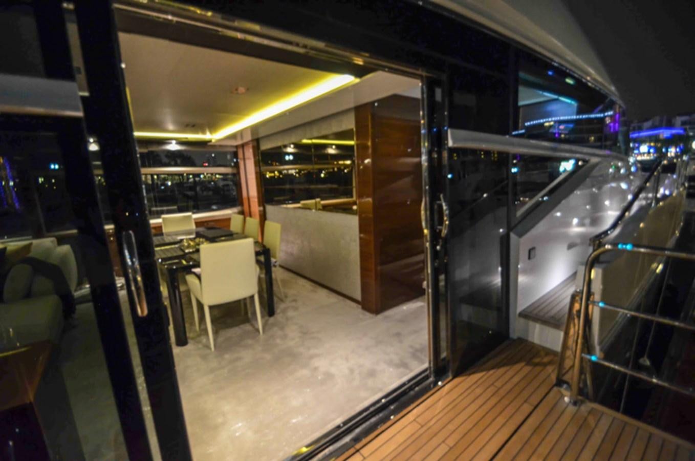 a room with a table and chairs aboard SEDNA Yacht for Sale