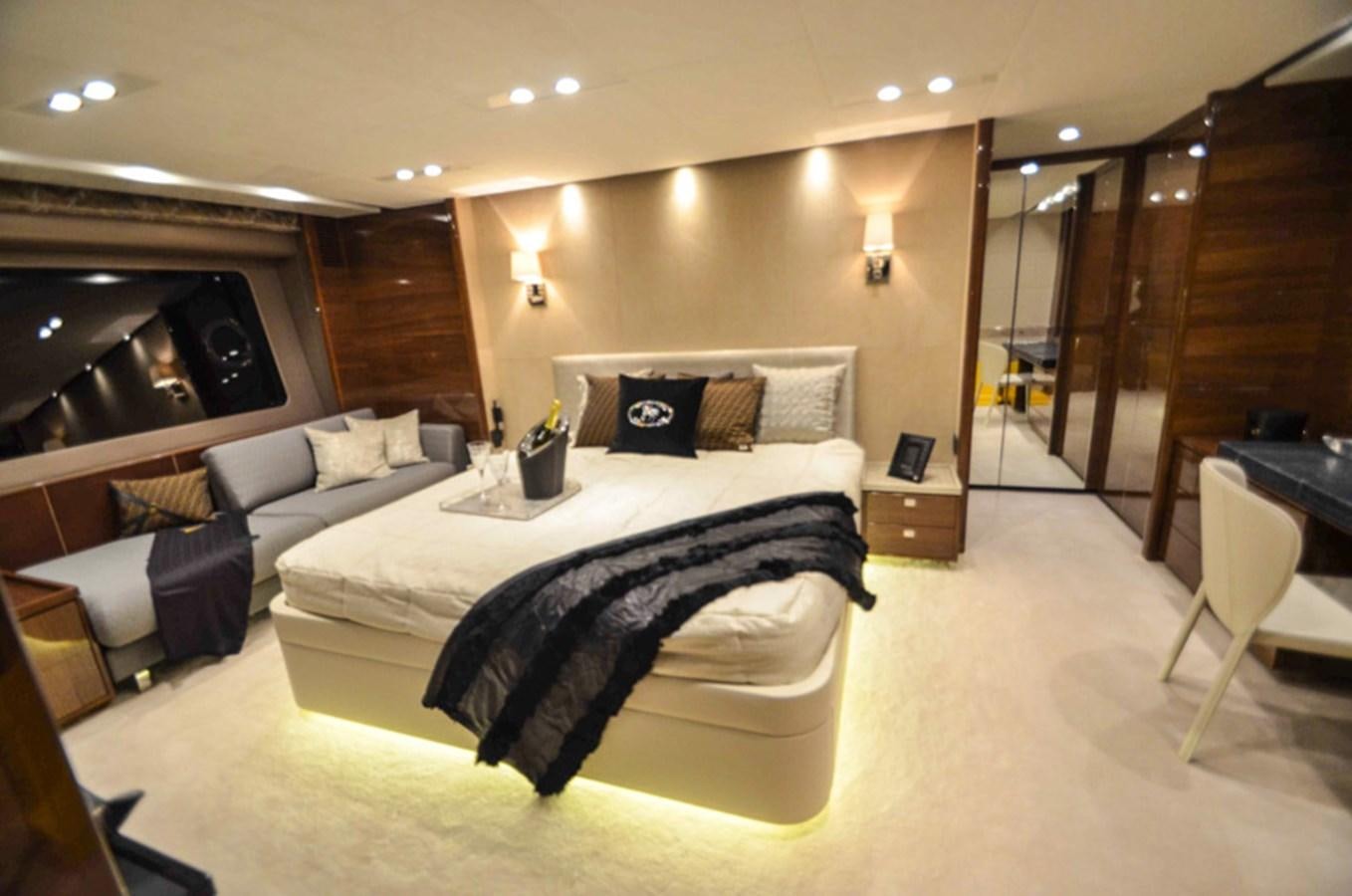 a large bedroom with a large bed aboard SEDNA Yacht for Sale