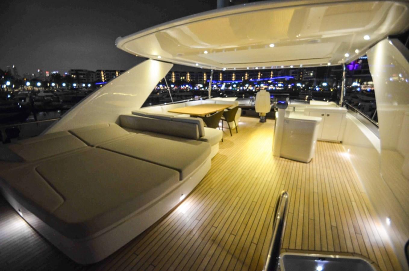 a room with a view of a city at night aboard SEDNA Yacht for Sale
