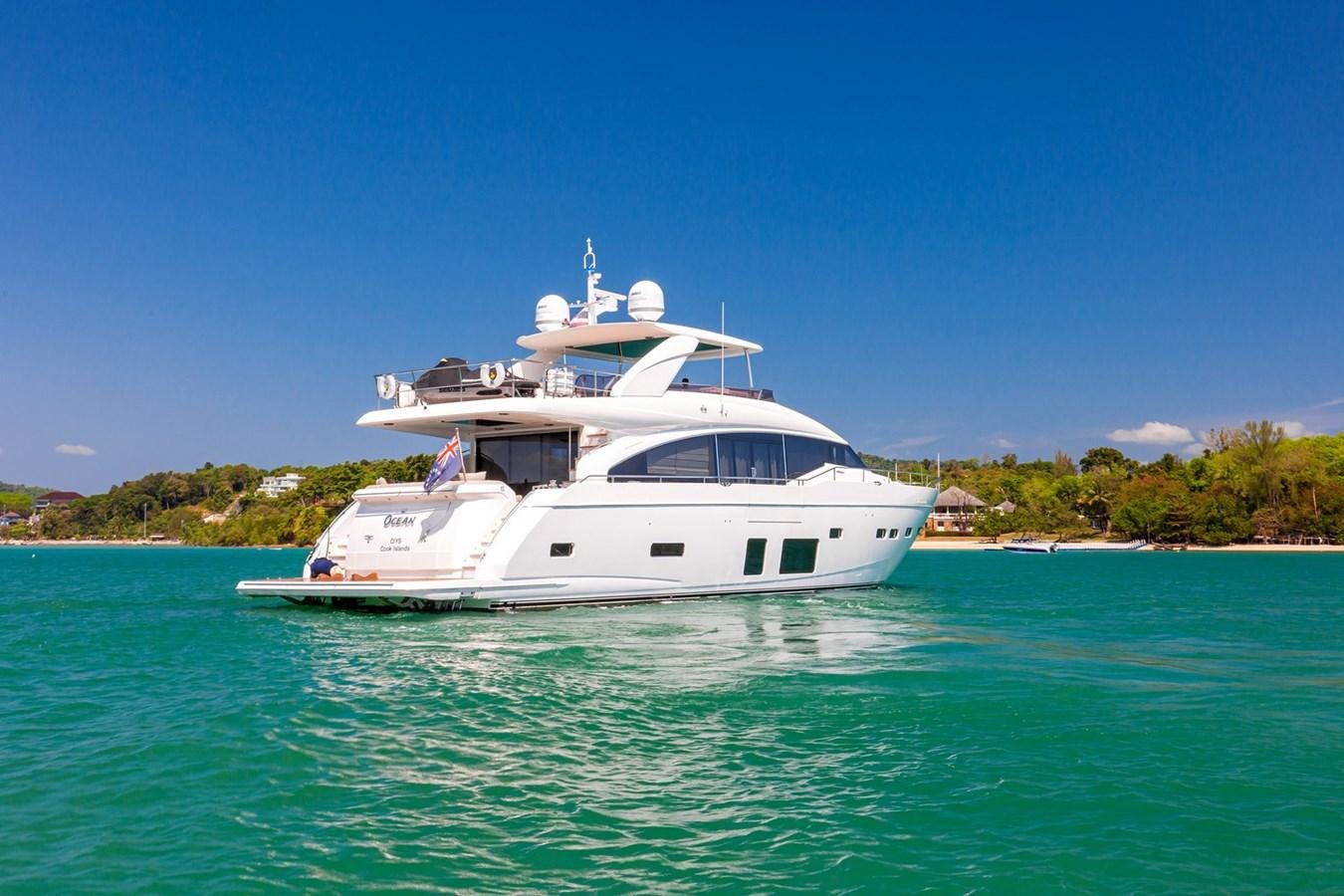 a white boat in the water aboard OCEAN Yacht for Sale