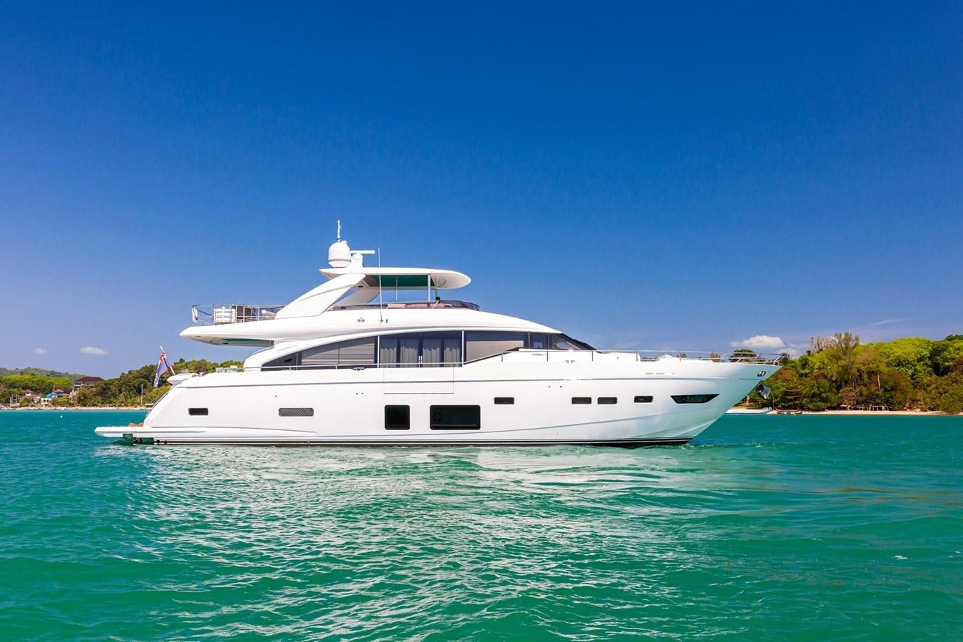 a white boat on the water aboard OCEAN Yacht for Sale