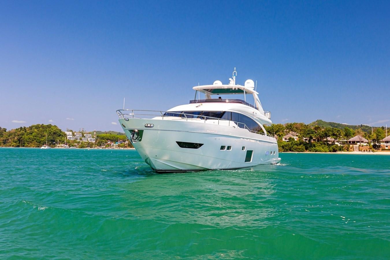 a white boat in the water aboard OCEAN Yacht for Sale