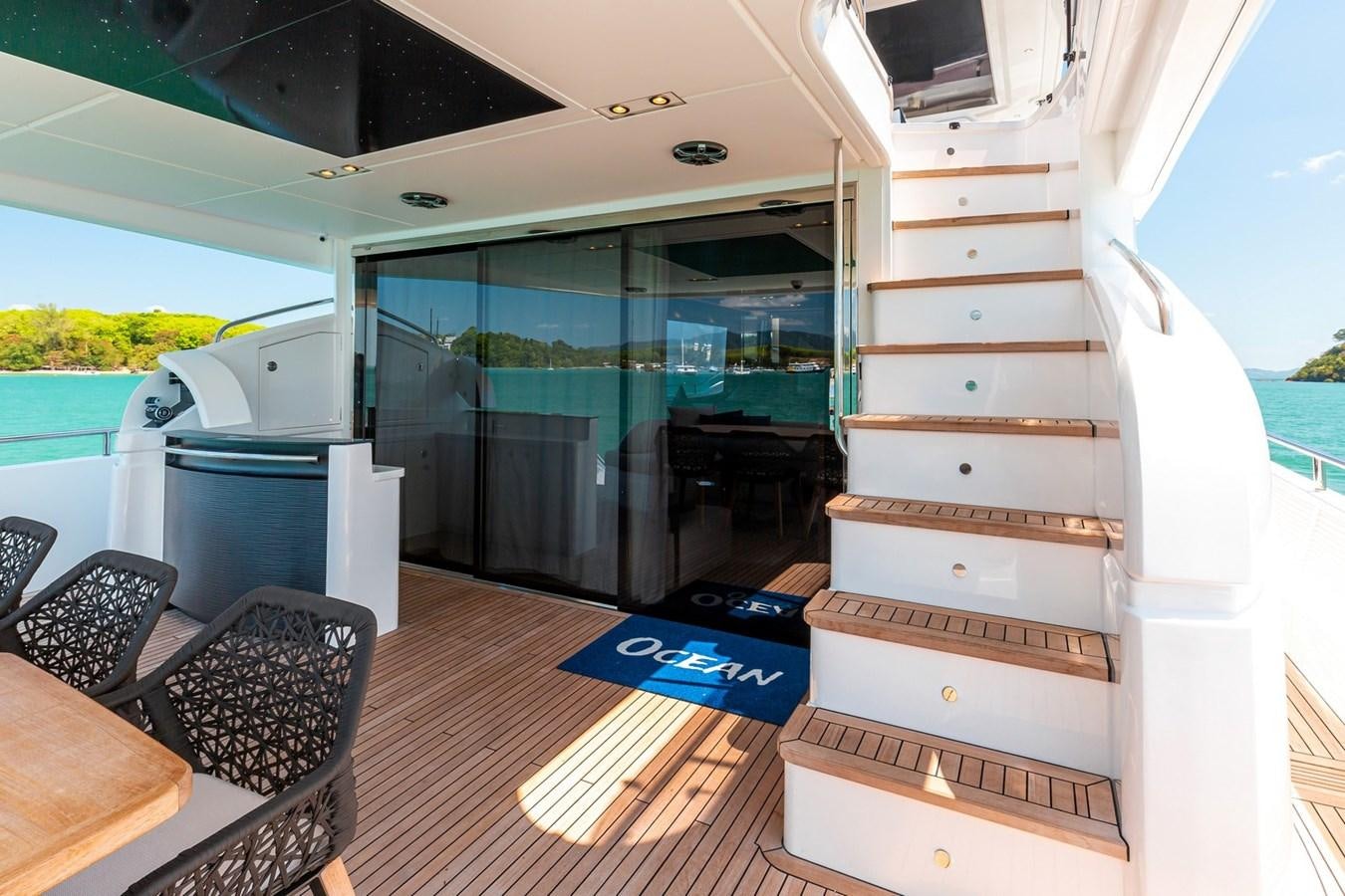 a room with a sliding door aboard OCEAN Yacht for Sale