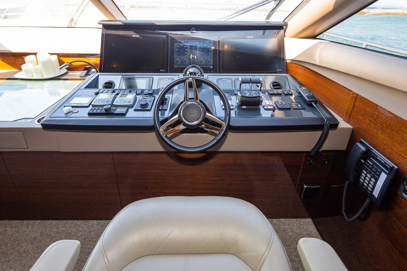 a black and silver radio on a table aboard OCEAN Yacht for Sale