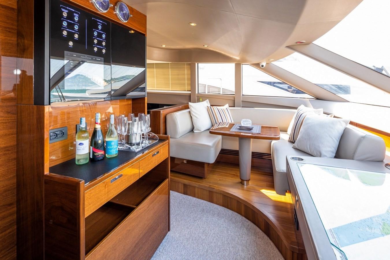 a living room with a table and a couch aboard OCEAN Yacht for Sale