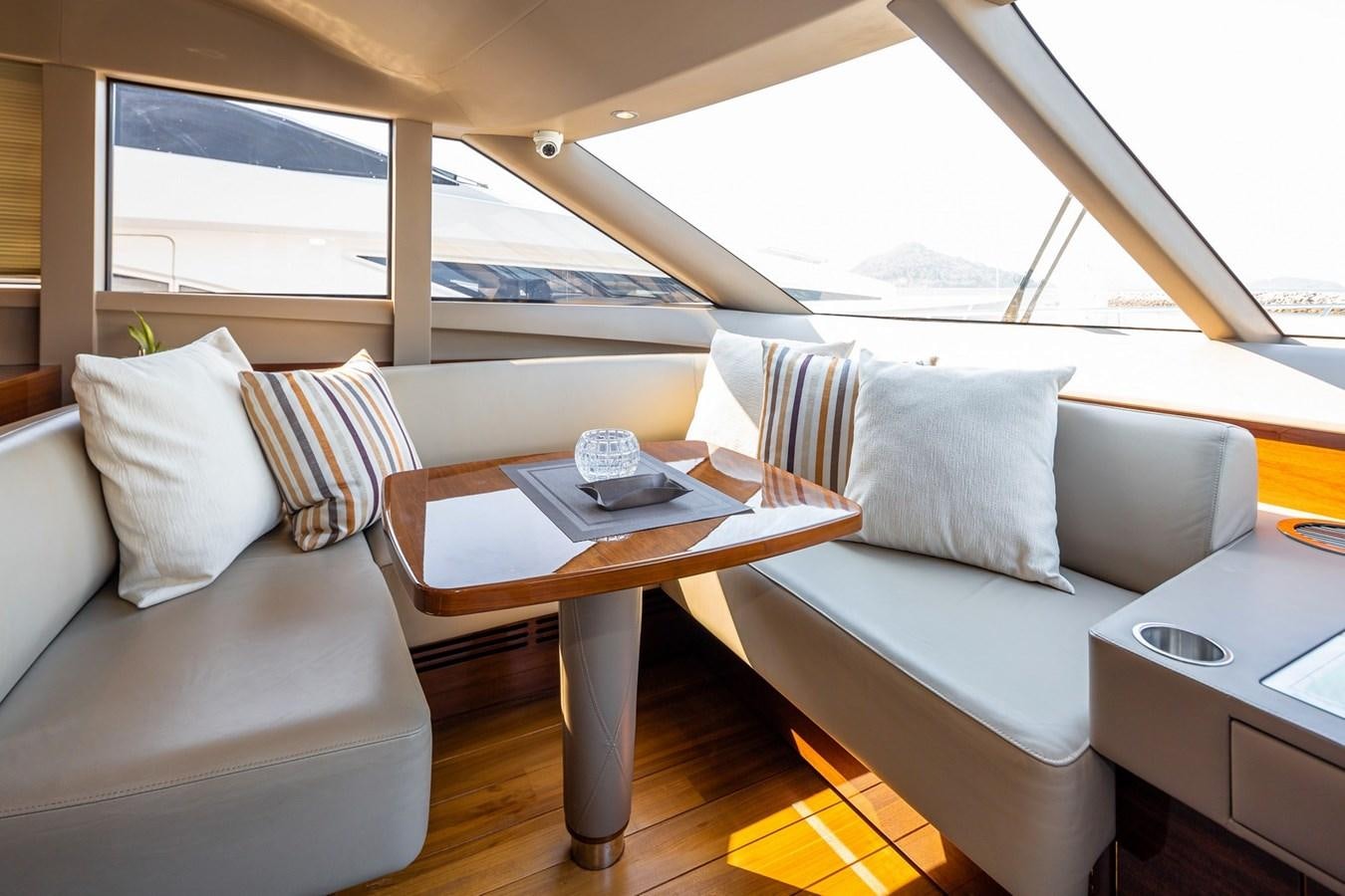 a car with a table and chairs aboard OCEAN Yacht for Sale