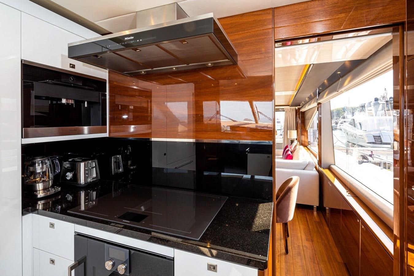 a kitchen with a stove and oven aboard OCEAN Yacht for Sale