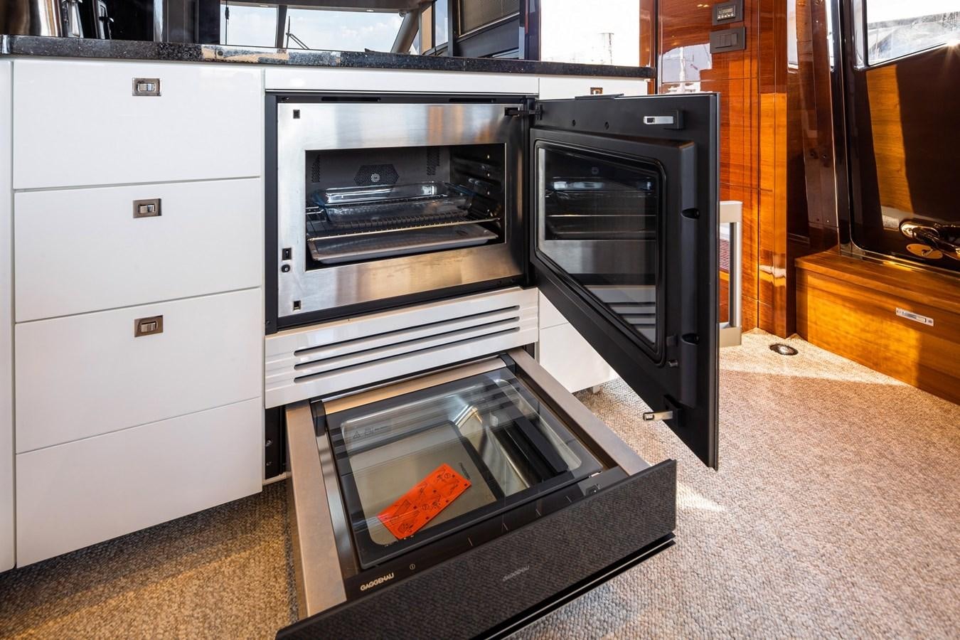 a kitchen with a stove and oven aboard OCEAN Yacht for Sale