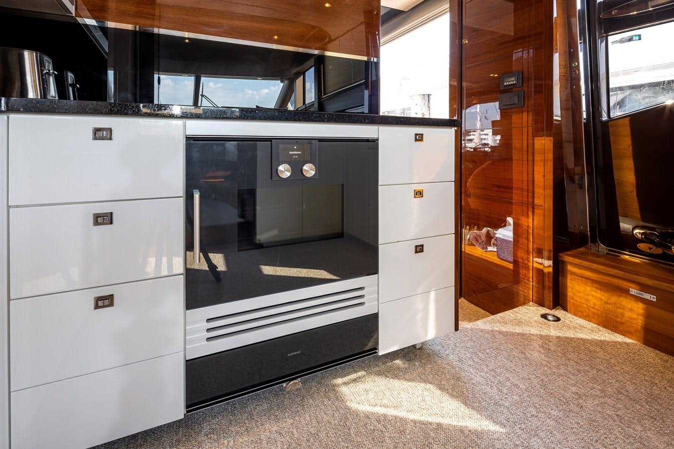 a kitchen with a large oven aboard OCEAN Yacht for Sale