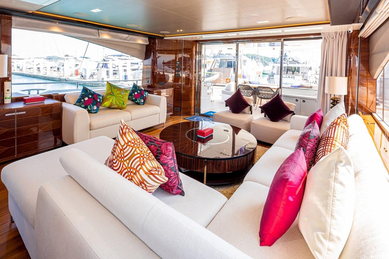 a living room with a large window aboard OCEAN Yacht for Sale