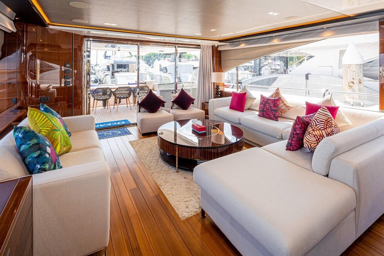 a living room with a large window aboard OCEAN Yacht for Sale