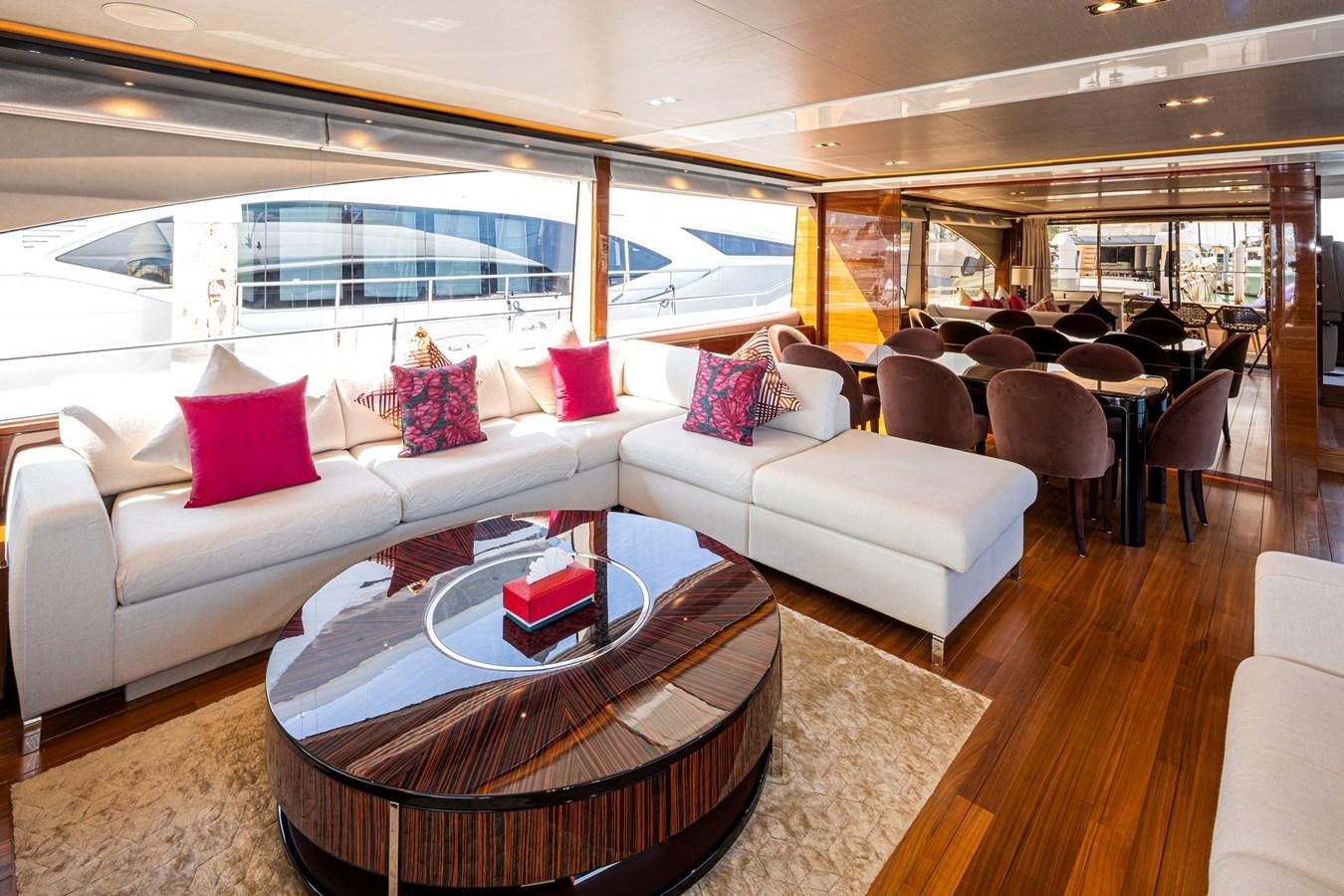 a living room with a large window aboard OCEAN Yacht for Sale