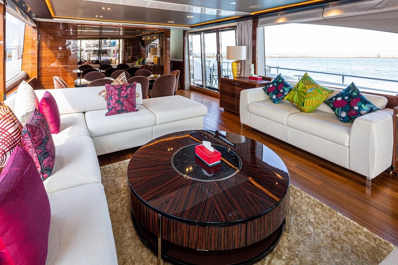 a living room with a large window aboard OCEAN Yacht for Sale