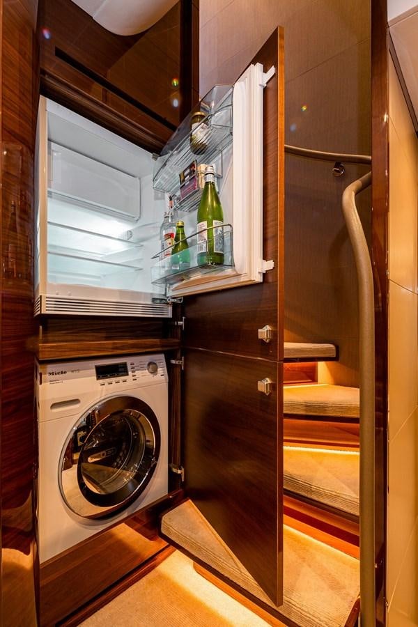 a washer and dryer in a room aboard OCEAN Yacht for Sale