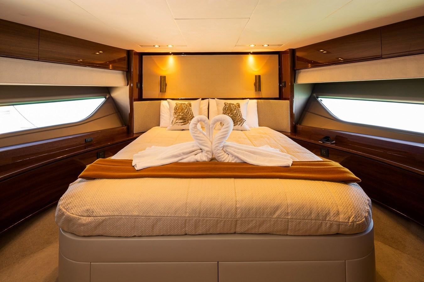 a couple of beds in a room aboard OCEAN Yacht for Sale
