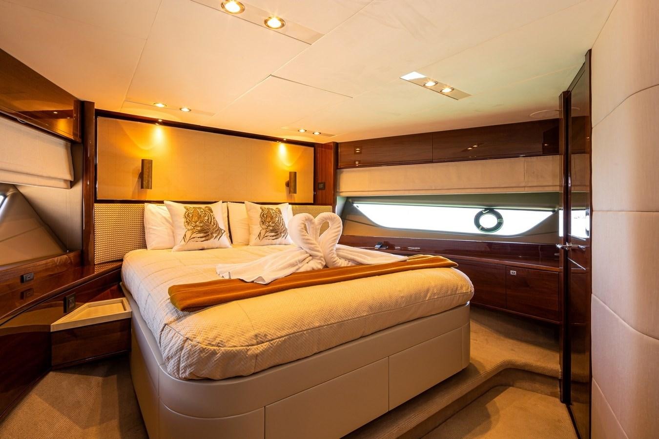 a room with a bed and a window aboard OCEAN Yacht for Sale