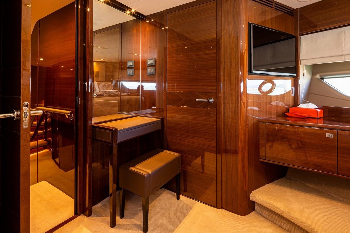 a room with a desk and a tv aboard OCEAN Yacht for Sale