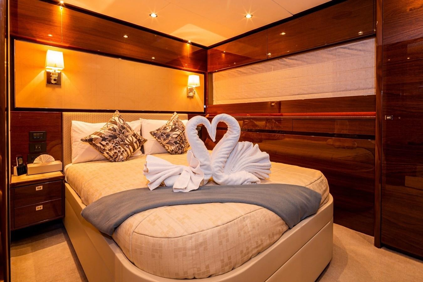 a person lying on a bed aboard OCEAN Yacht for Sale