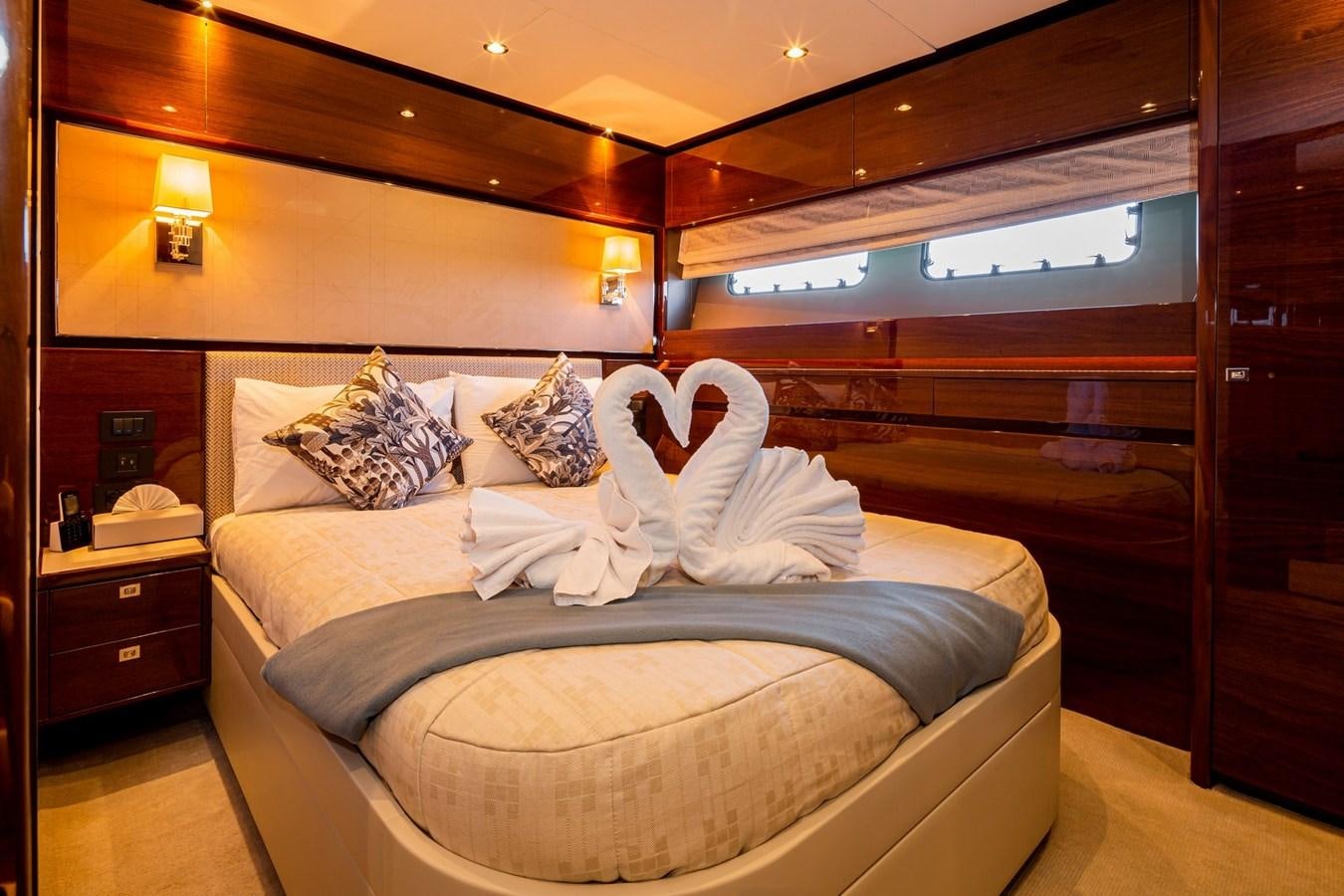 a bed in a room aboard OCEAN Yacht for Sale
