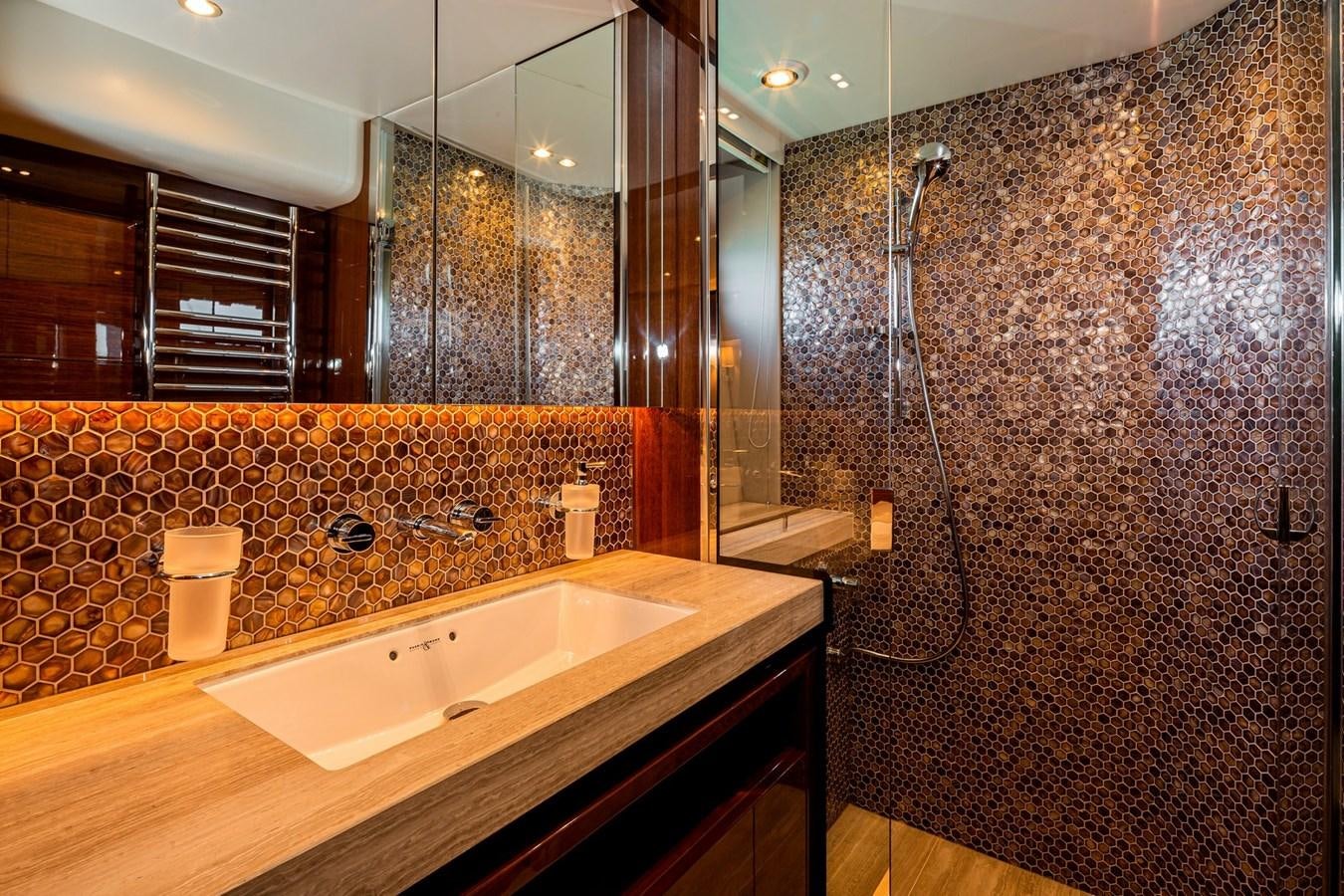 a bathroom with a shower and a sink aboard OCEAN Yacht for Sale