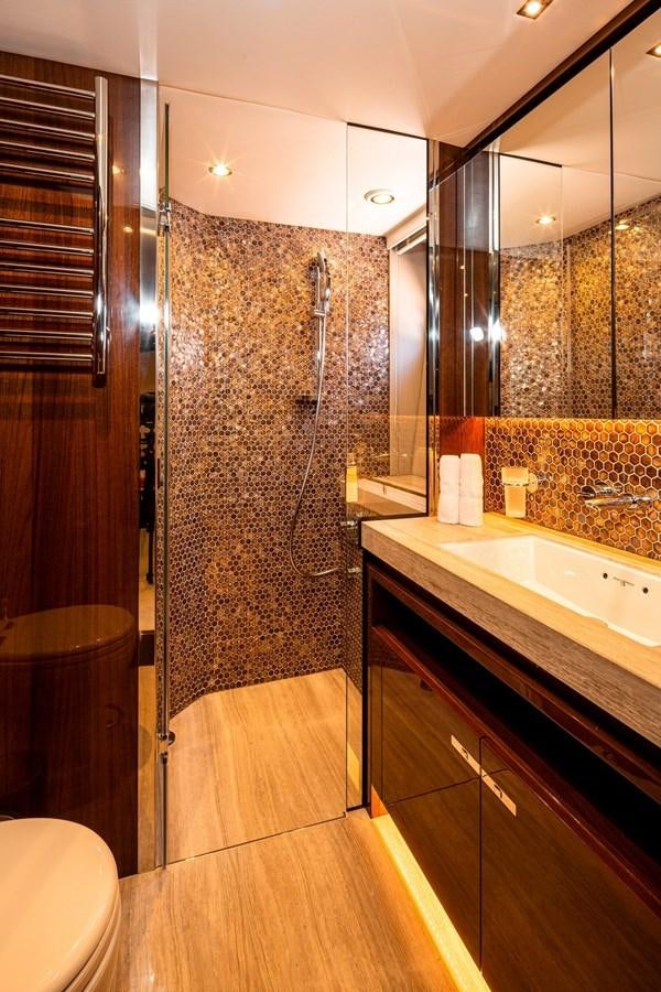 a bathroom with a shower and sink aboard OCEAN Yacht for Sale