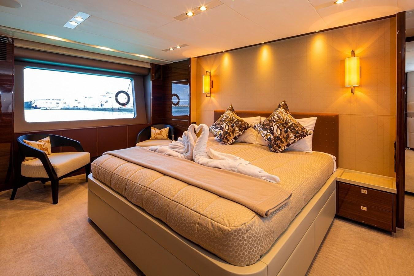 a bed with a large bed aboard OCEAN Yacht for Sale