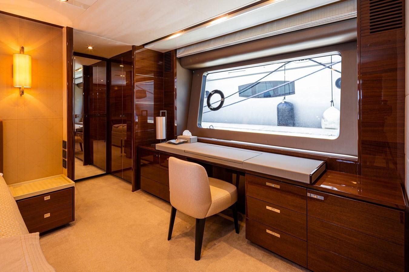 a room with a desk and a tv aboard OCEAN Yacht for Sale