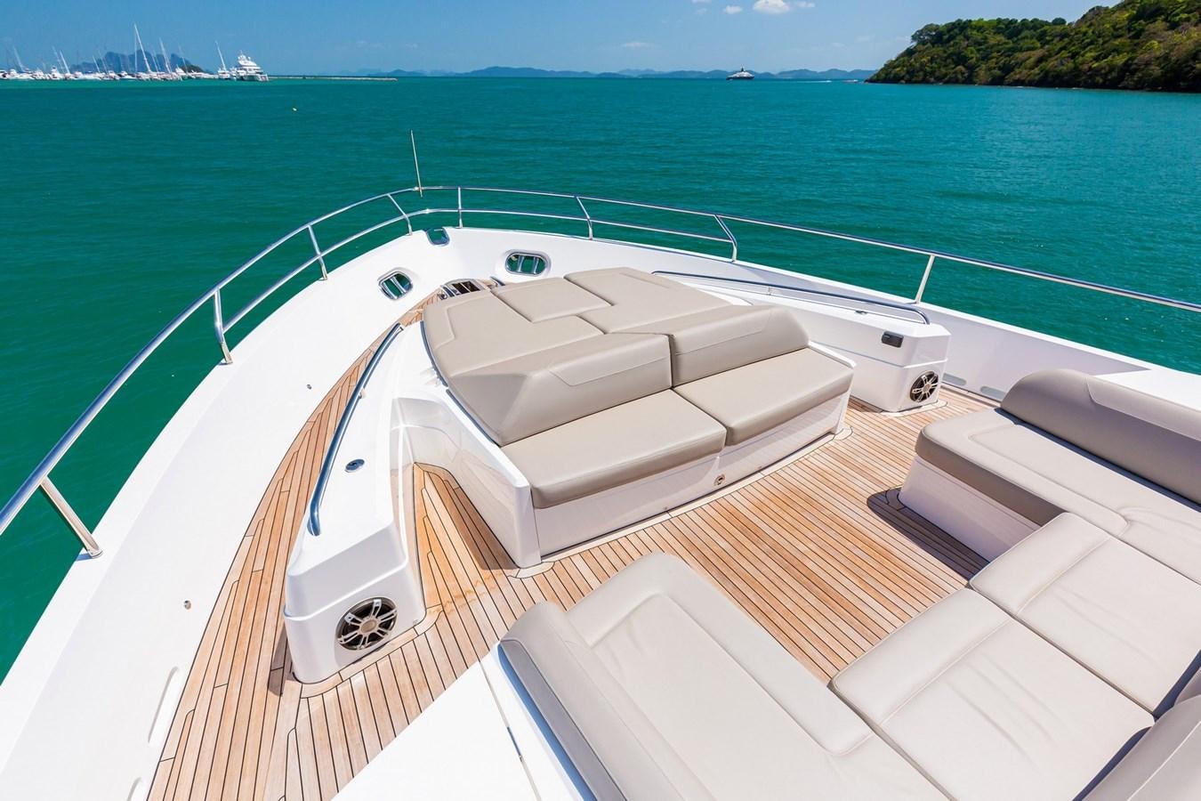 a deck with a pool and a boat on it aboard OCEAN Yacht for Sale