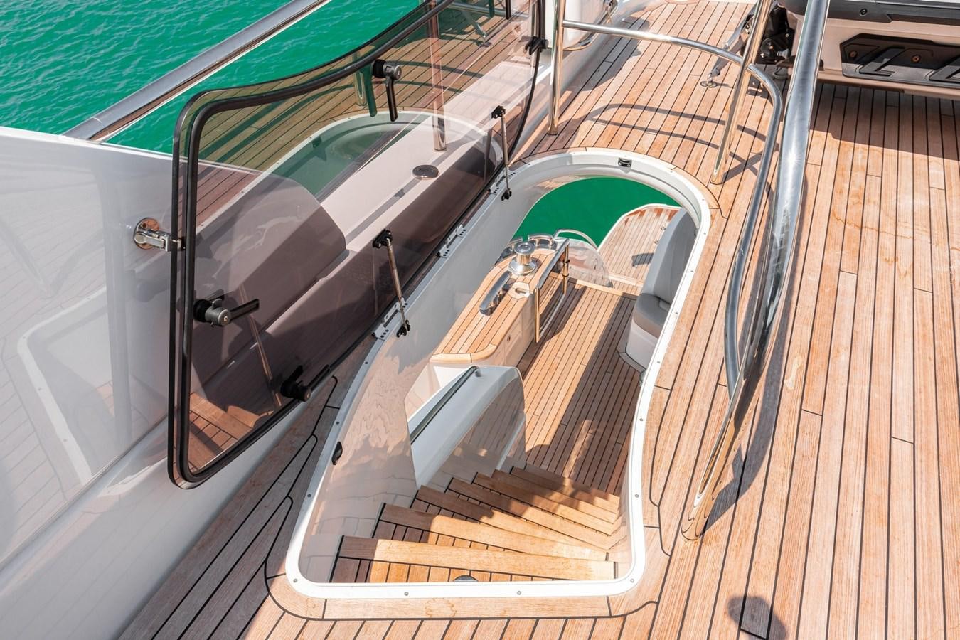 a car on a wooden deck aboard OCEAN Yacht for Sale