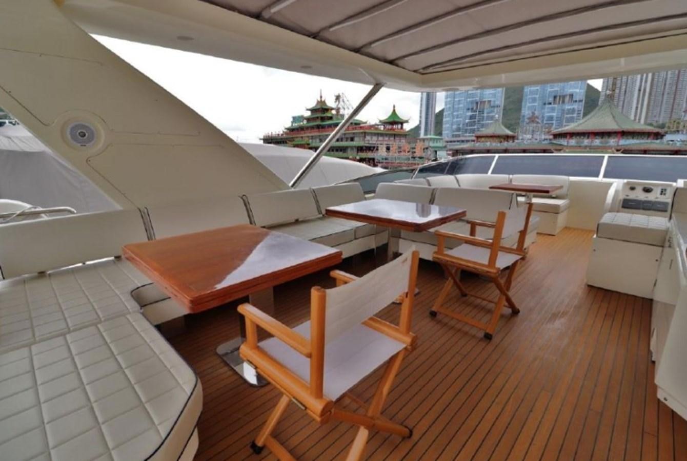 a room with tables and chairs aboard AZIMUT AZ 85/124 Yacht for Sale