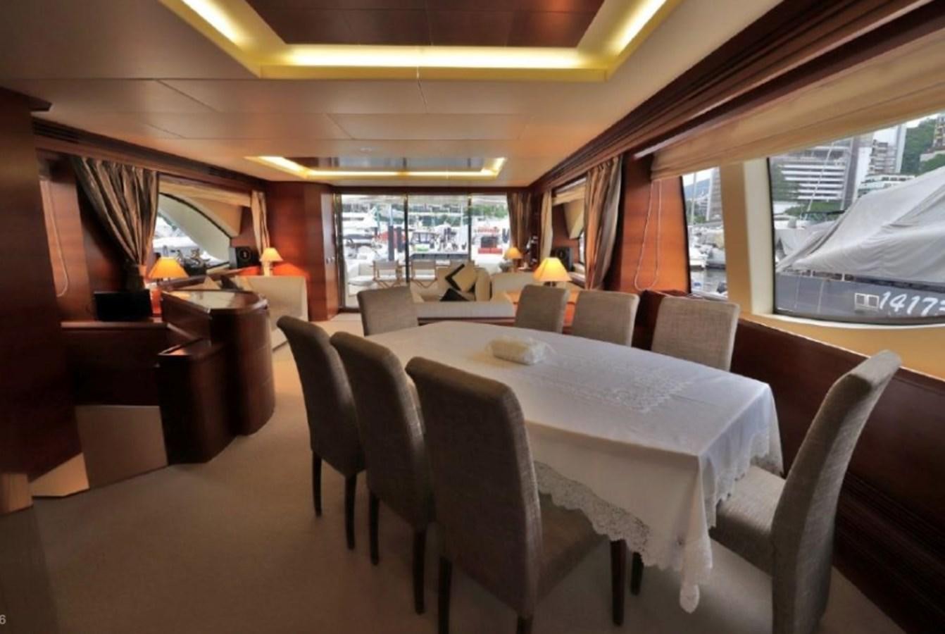 a dining room with a table and chairs aboard AZIMUT AZ 85/124 Yacht for Sale