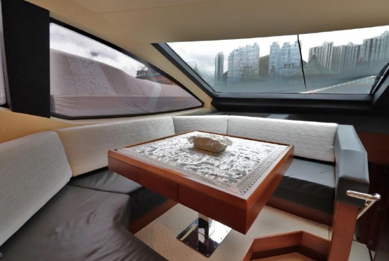 a room with a table and a window aboard AZIMUT AZ 85/124 Yacht for Sale