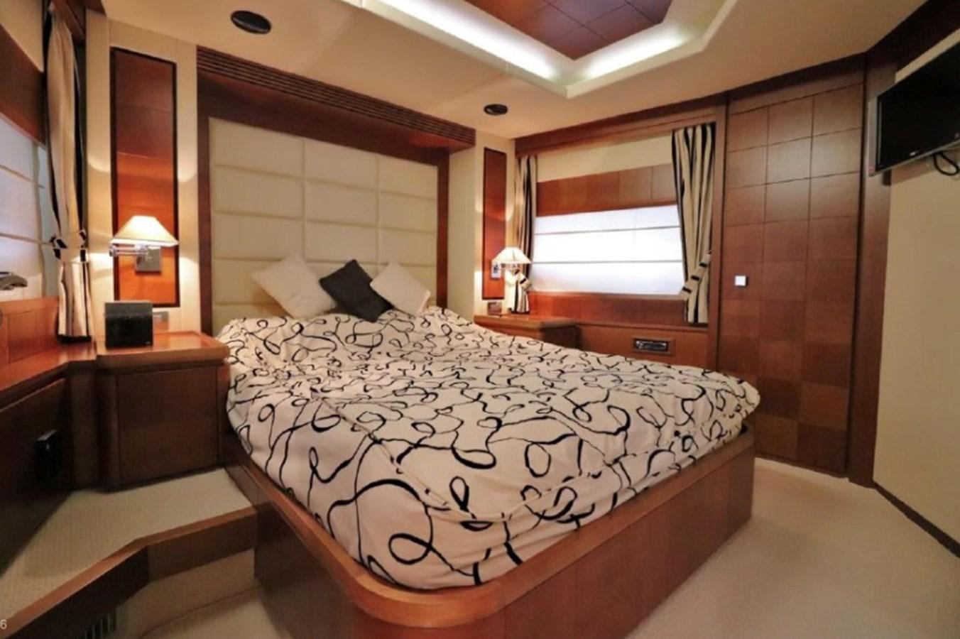 a bedroom with a bed and a window aboard AZIMUT AZ 85/124 Yacht for Sale