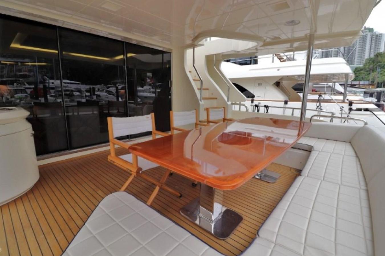 a room with a table and chairs aboard AZIMUT AZ 85/124 Yacht for Sale