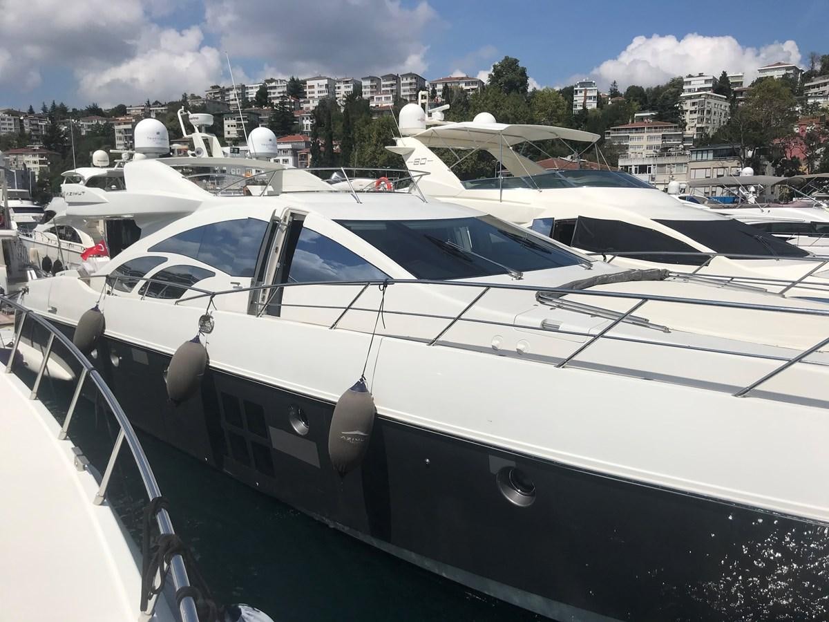 a group of boats are parked in a harbor aboard PATRIOT Yacht for Sale