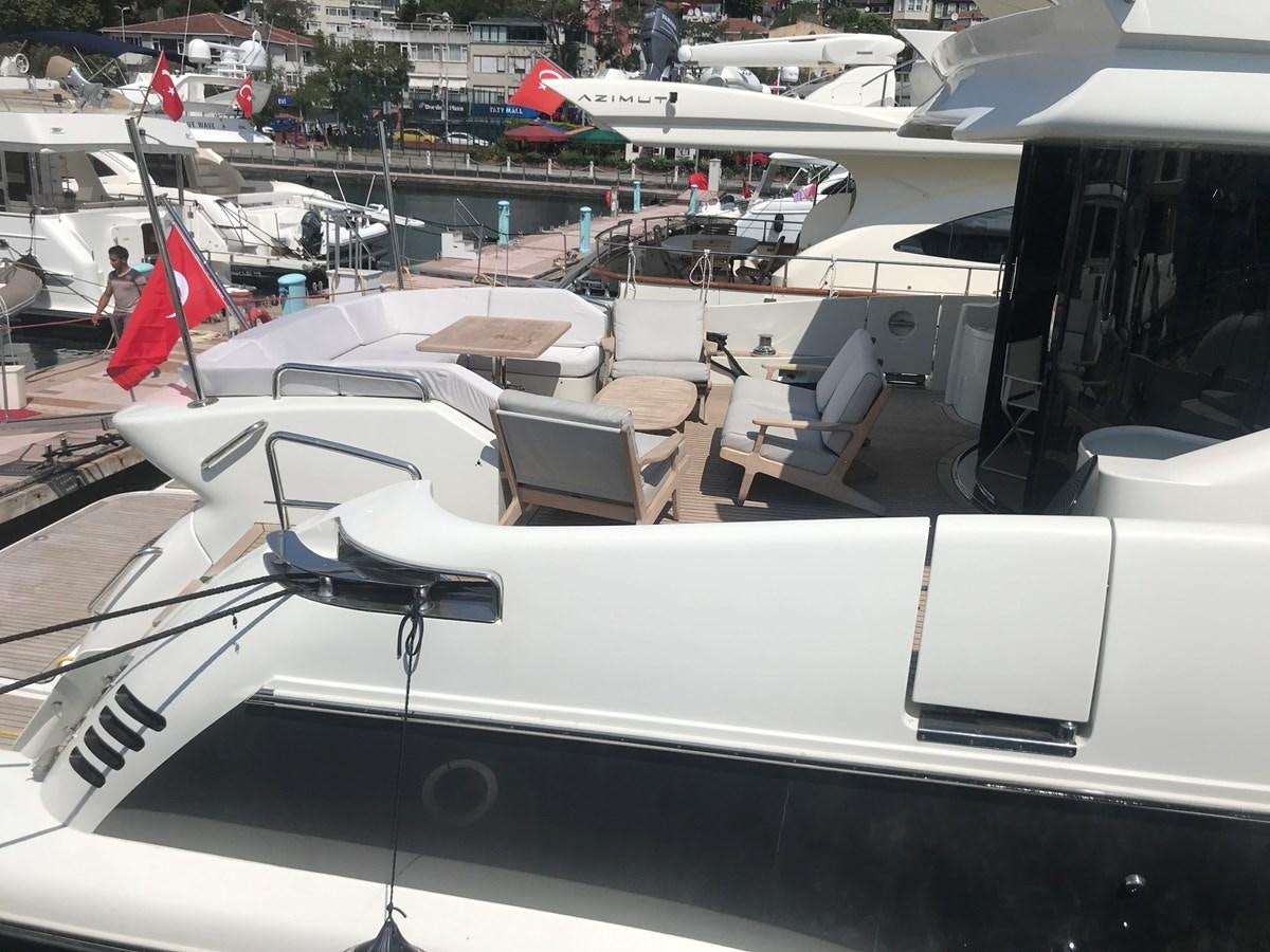 a boat with chairs and tables aboard PATRIOT Yacht for Sale