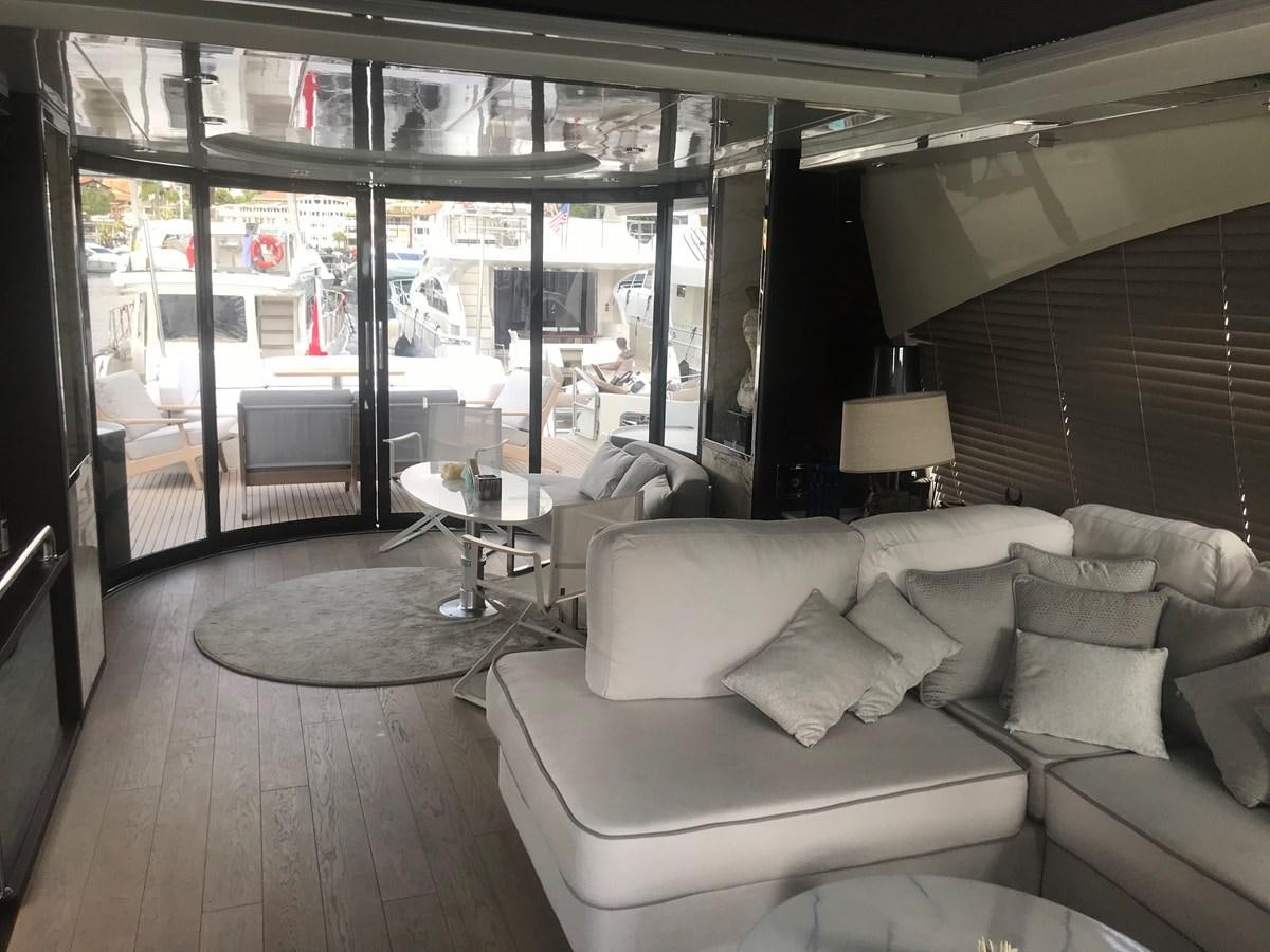a living room with a large window aboard PATRIOT Yacht for Sale
