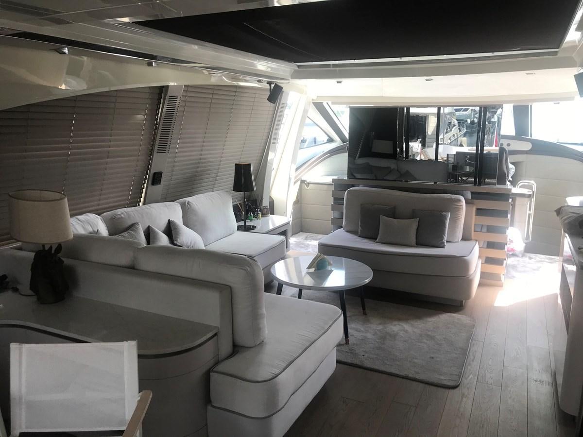 a living room with a large window aboard PATRIOT Yacht for Sale
