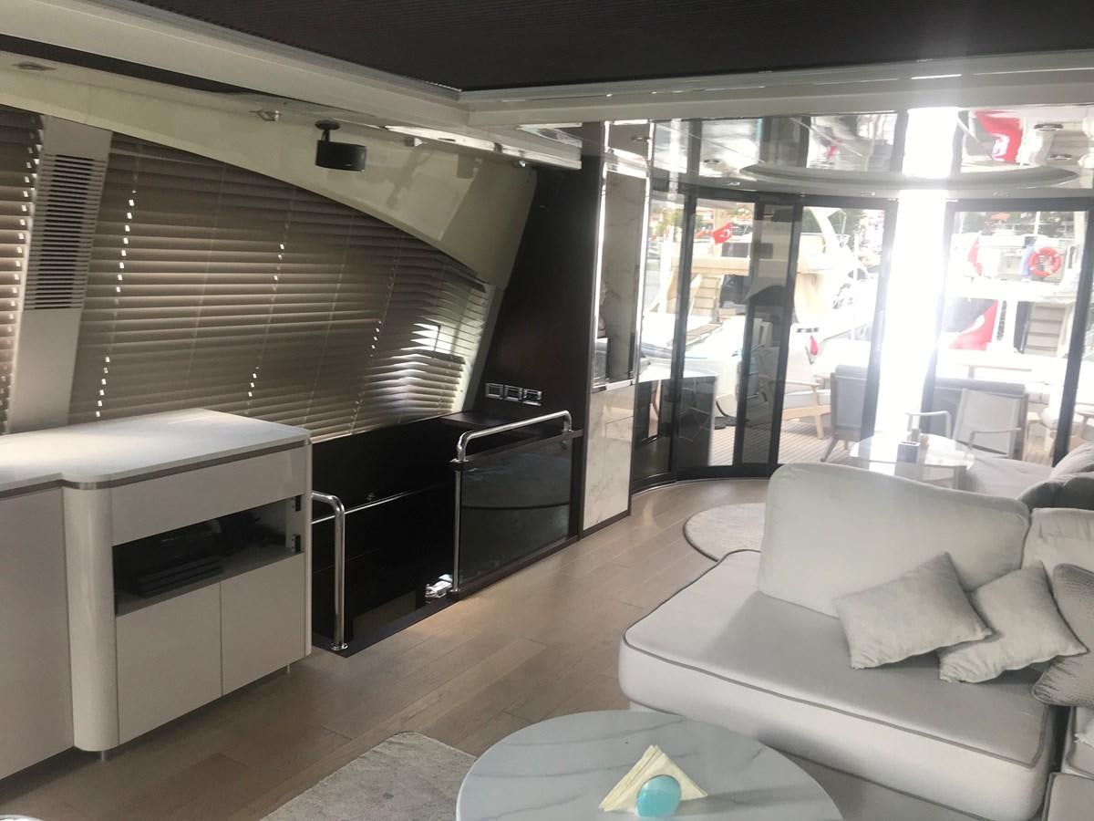 a room with a couch and a table aboard PATRIOT Yacht for Sale