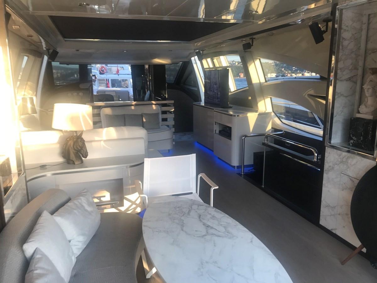 a room with a bed and a table aboard PATRIOT Yacht for Sale