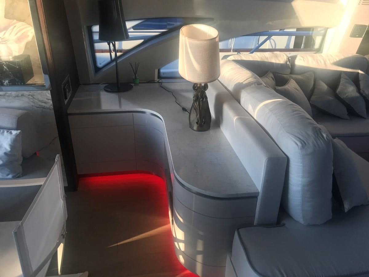 a car with a lamp and a couch in it aboard PATRIOT Yacht for Sale