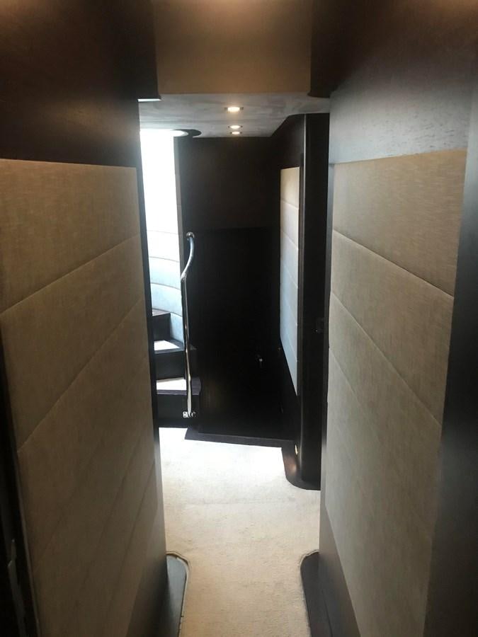 a hallway with a door aboard PATRIOT Yacht for Sale