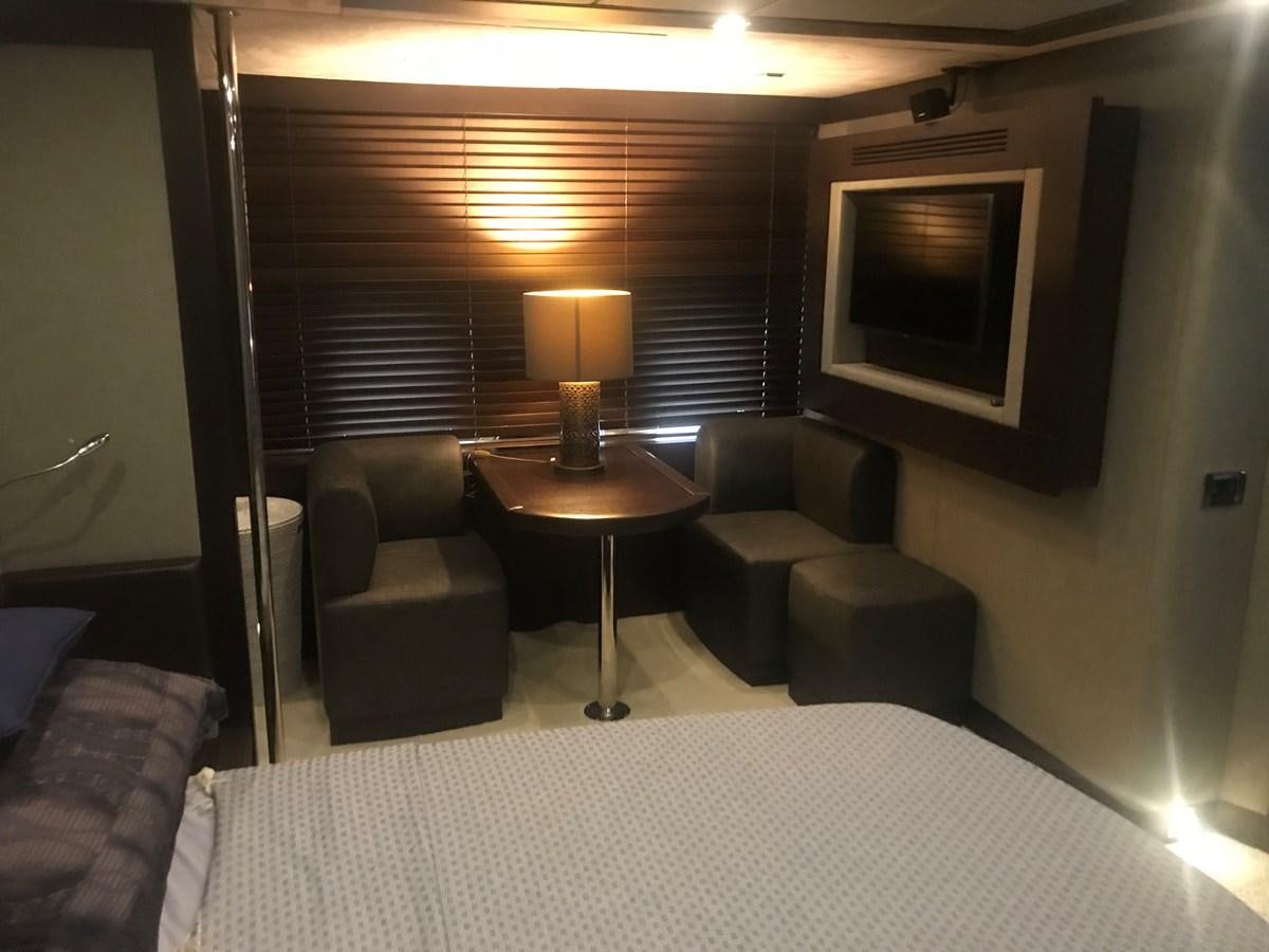 a living room with a large television aboard PATRIOT Yacht for Sale