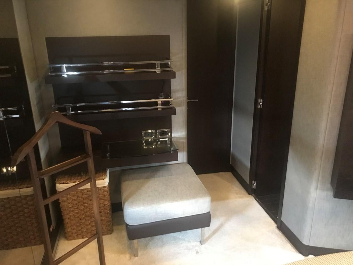 a chair next to a fireplace aboard PATRIOT Yacht for Sale