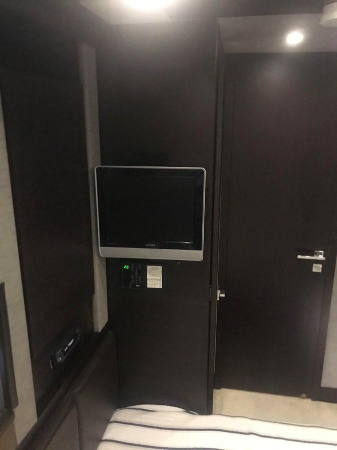 a tv in a room aboard PATRIOT Yacht for Sale