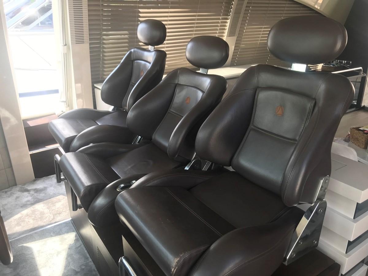 a black leather chair aboard PATRIOT Yacht for Sale