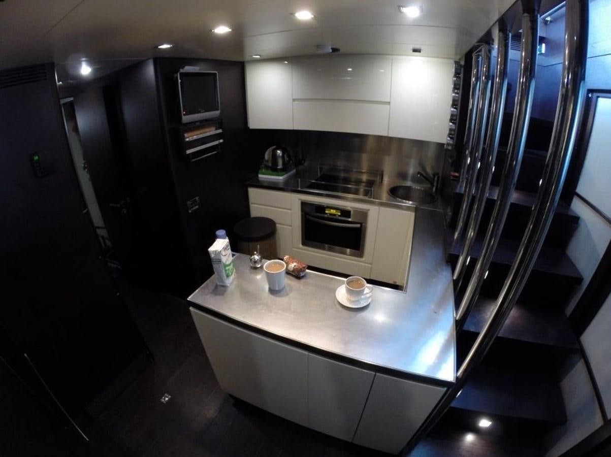 a kitchen with a glass door aboard PATRIOT Yacht for Sale